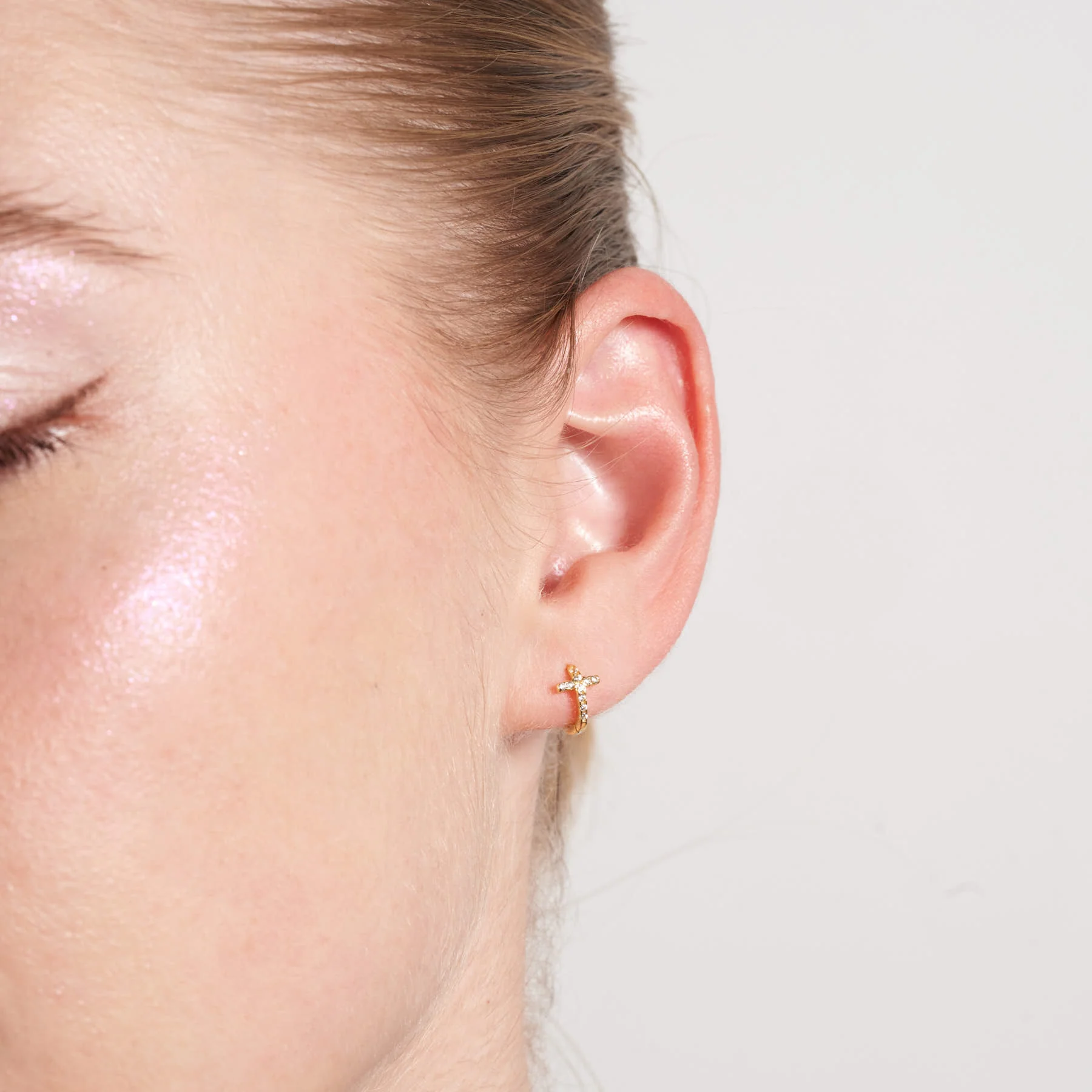Crystal Paved Cross Huggie Hoops In Gold - Image 2
