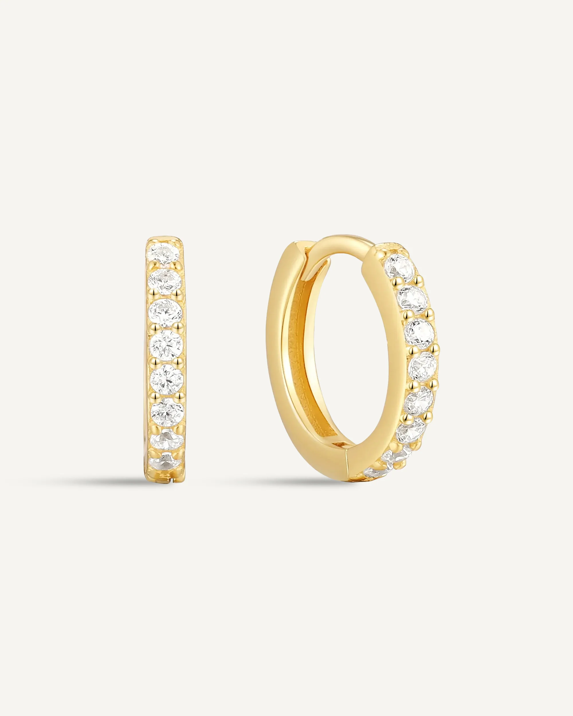 Crystal Paved Huggie Hoops In Gold - Image 11