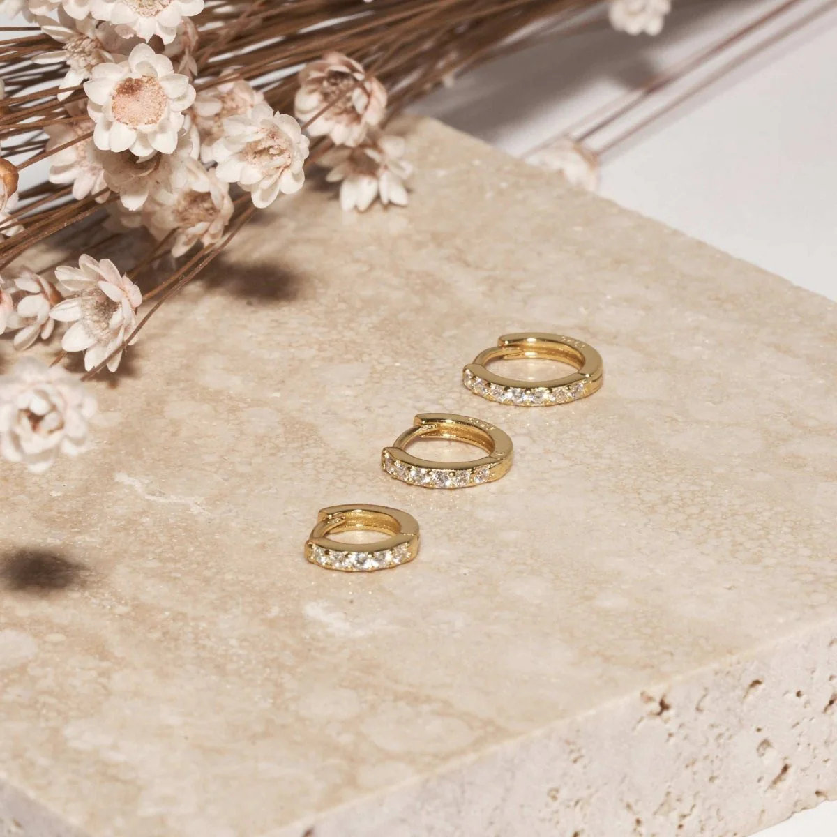 Crystal Paved Huggie Hoops In Gold - Image 3