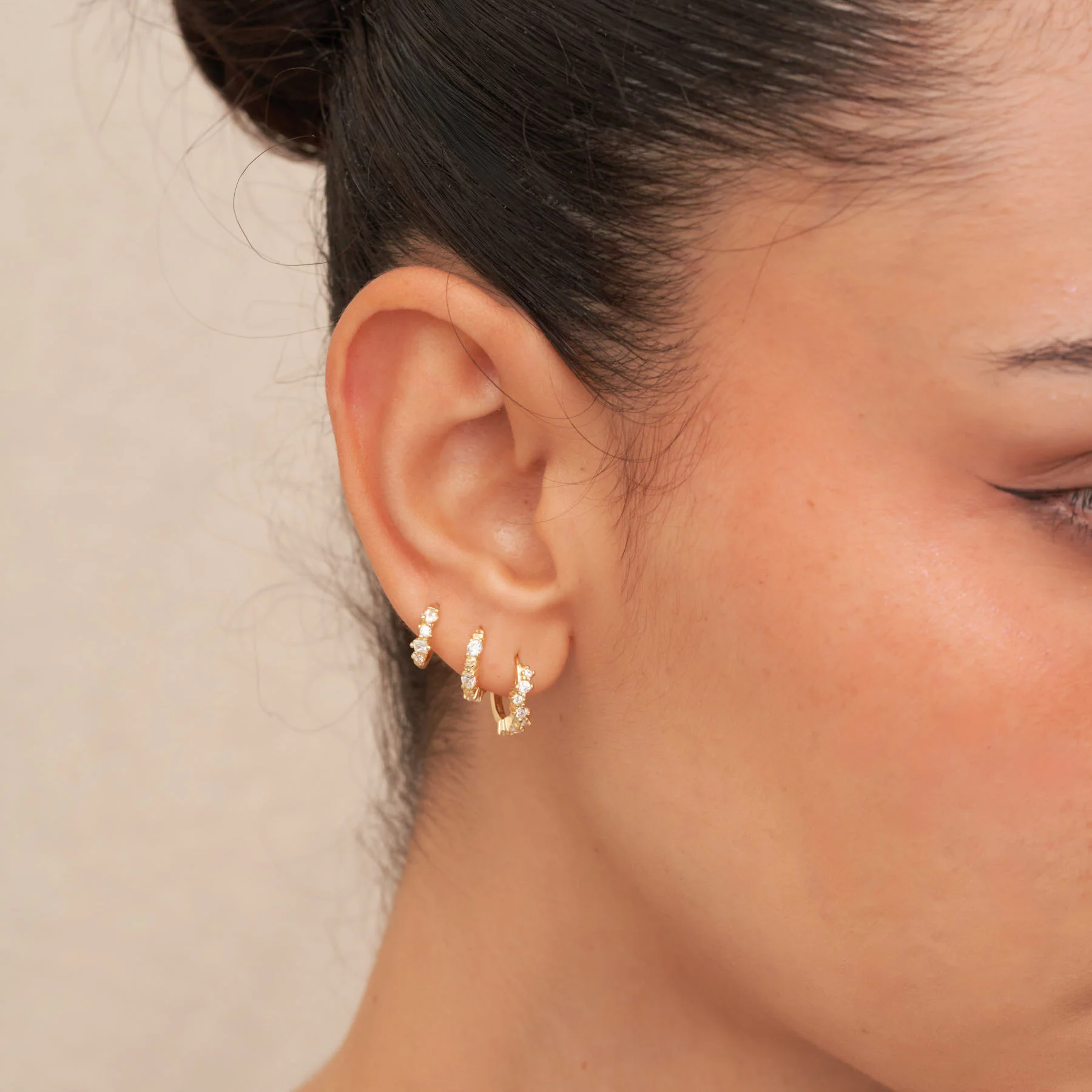 Irregular Crystal Huggie Hoops in Gold - Image 3