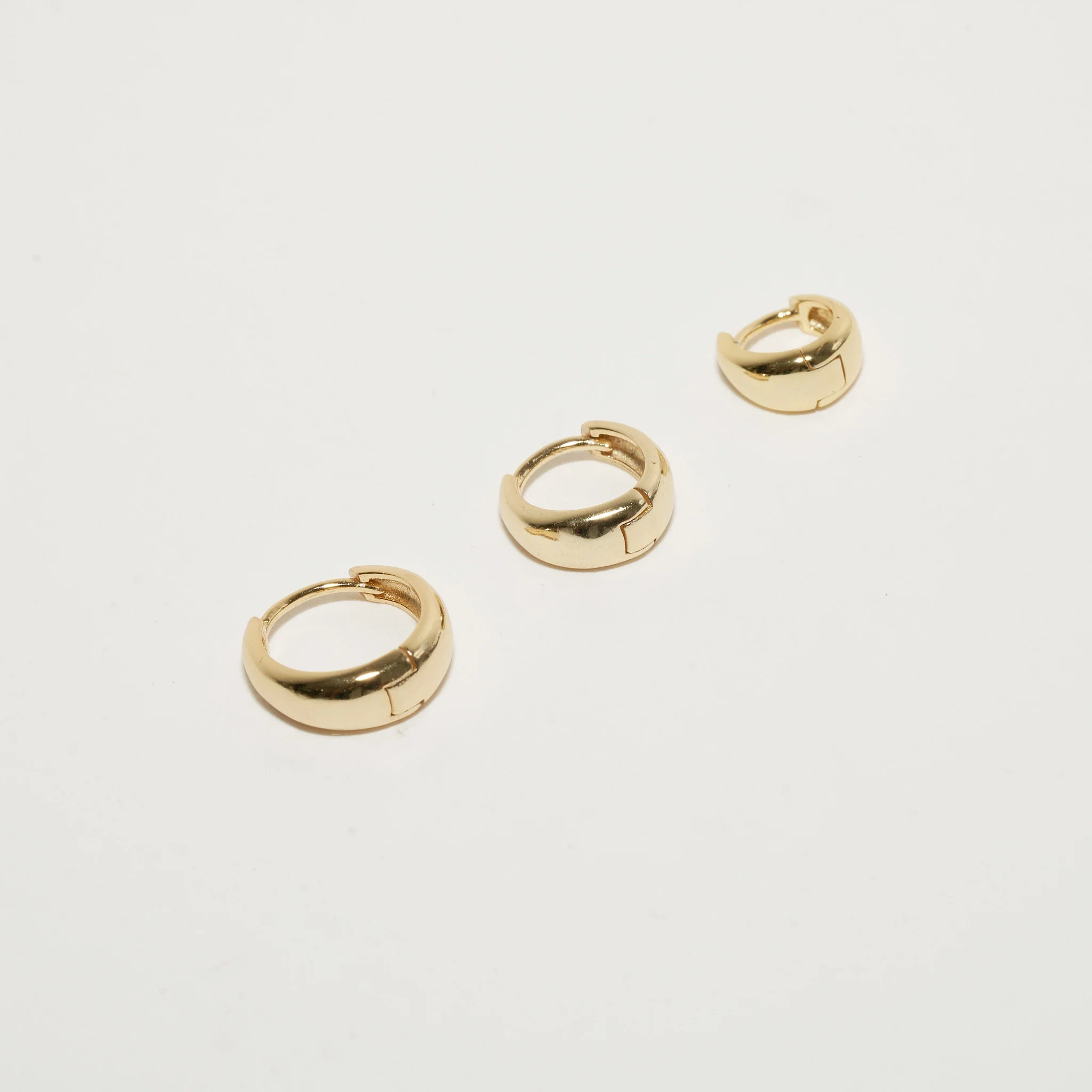 Tapered Huggie Hoops In Gold - Image 3