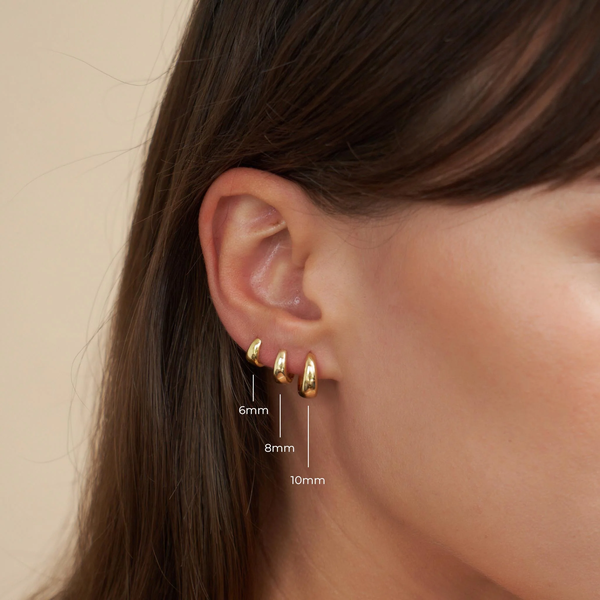 Tapered Huggie Hoops In Gold - Image 5