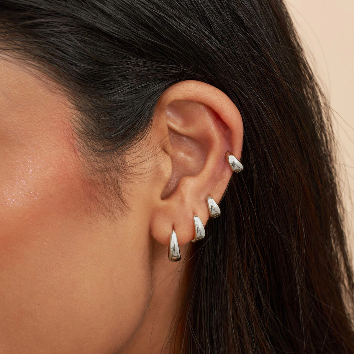 Tapered Huggie Hoops In Silver - Image 2