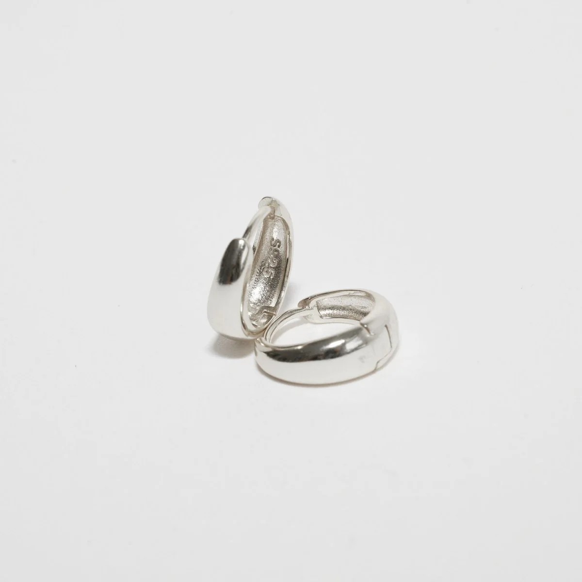 Tapered Huggie Hoops In Silver - Image 4