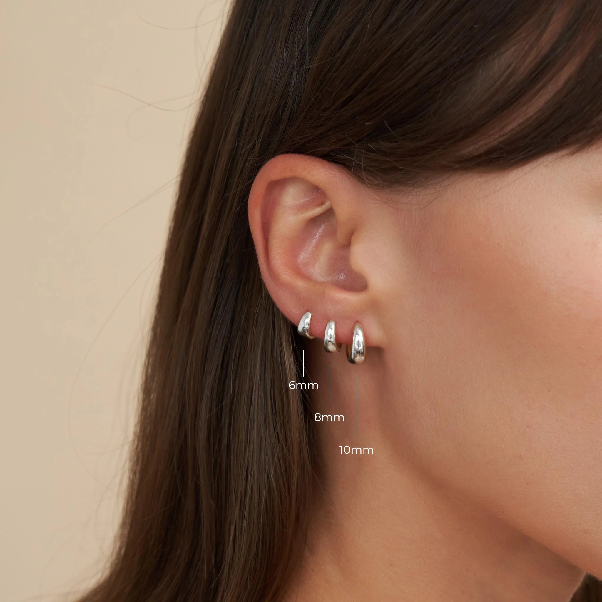 Tapered Huggie Hoops In Silver - Image 5