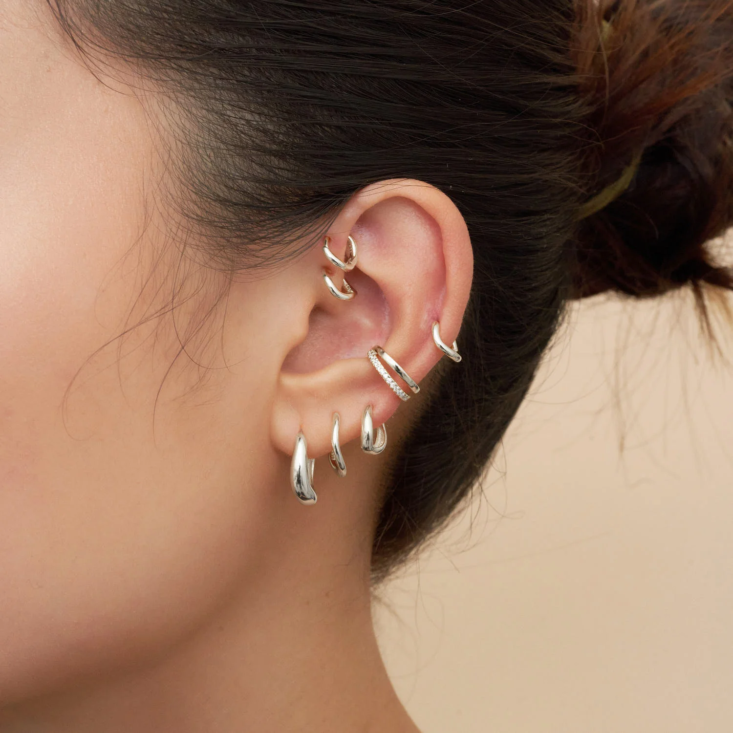 Tapered Wavy Huggie Hoops In Silver - Image 2
