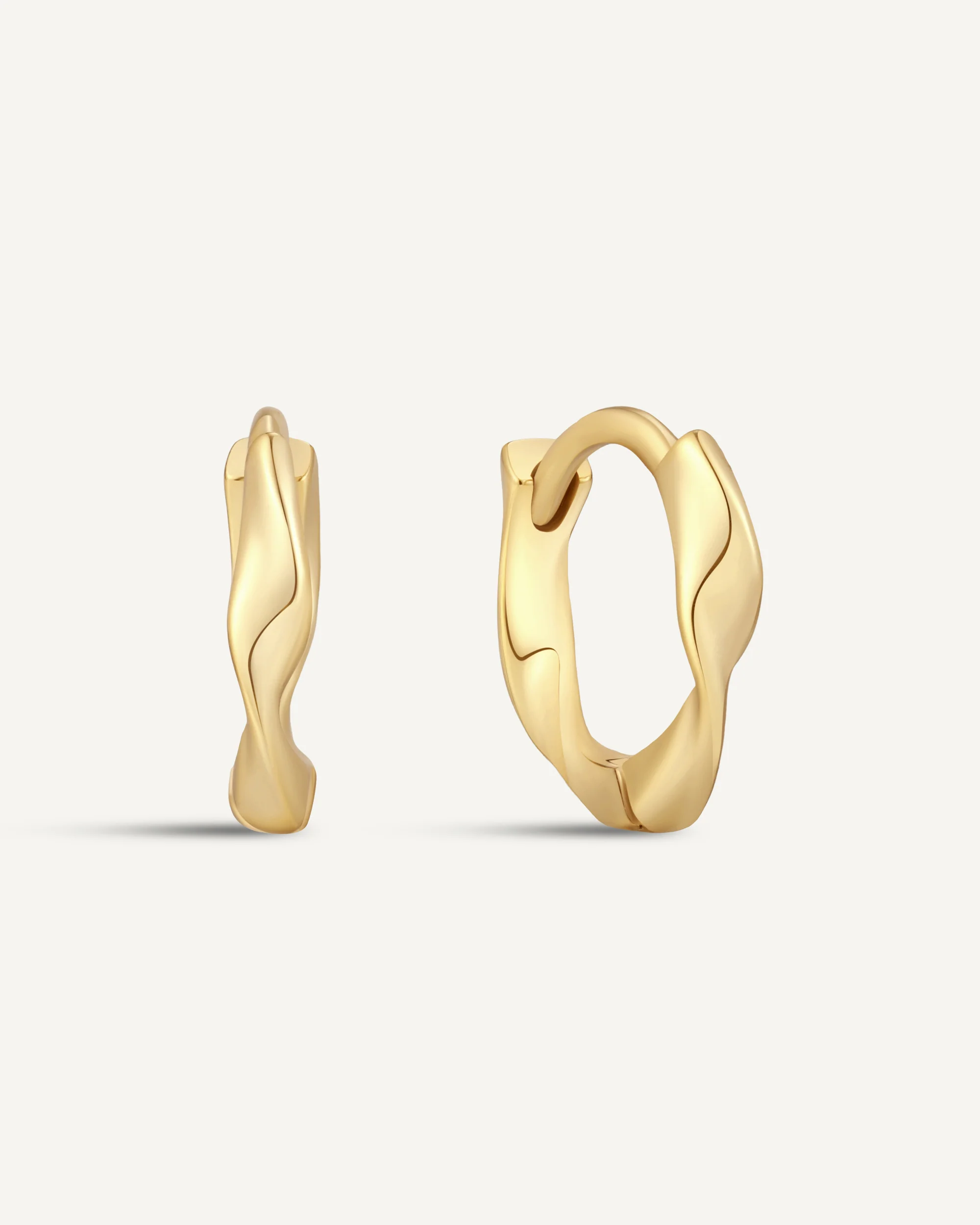 Twisted Huggie Hoops In Gold - Image 11