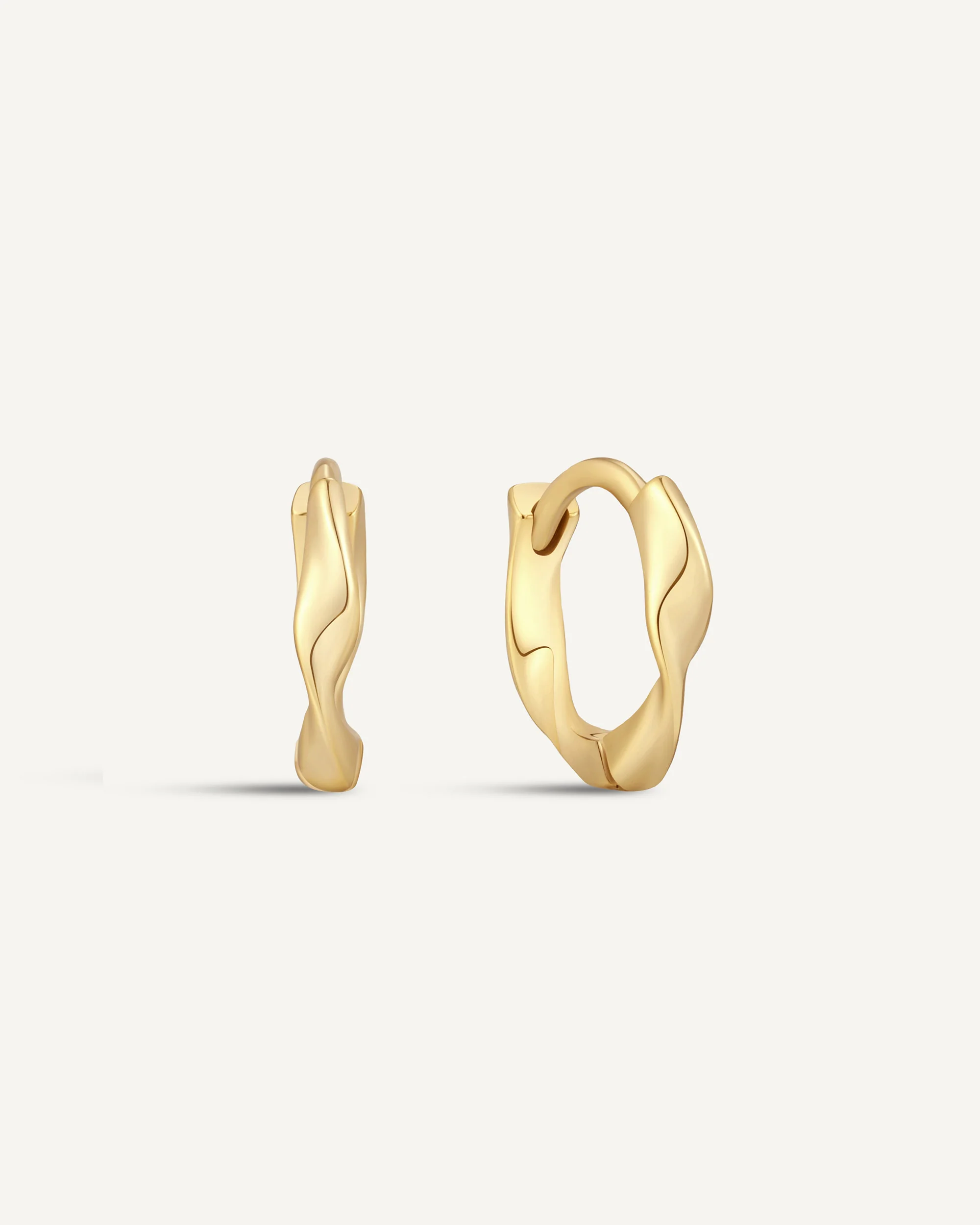 Twisted Huggie Hoops In Gold - Image 9