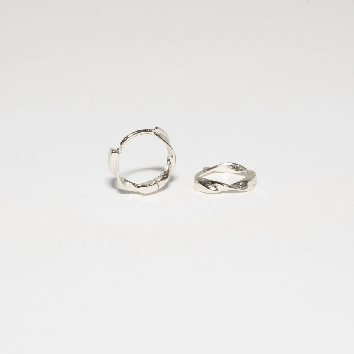 Twisted Huggie Hoops In Silver - Image 6