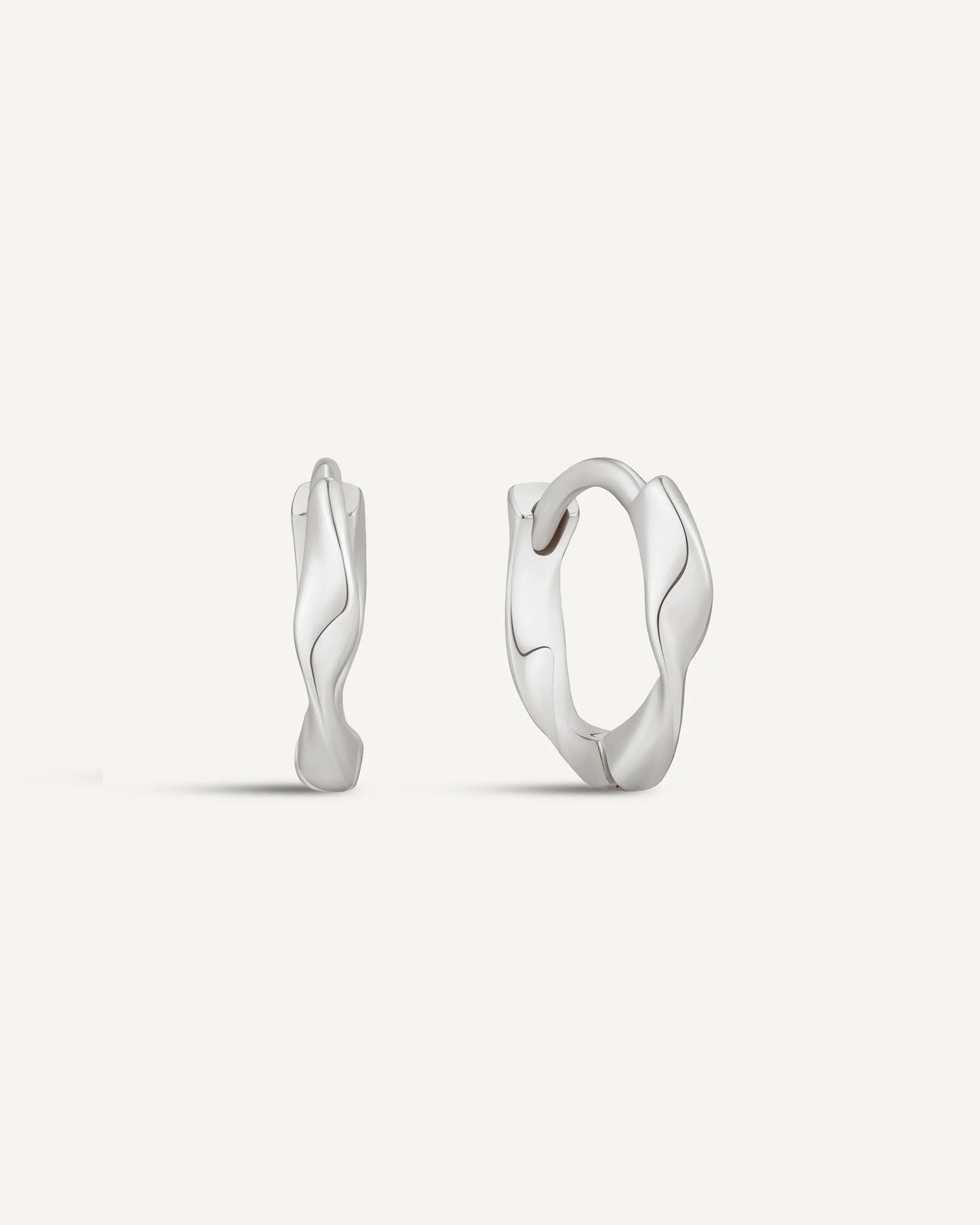 Twisted Huggie Hoops In Silver - Image 9